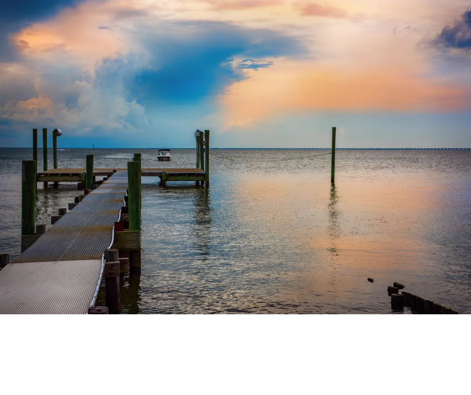 A picture of water with a walkway to a pier over the water in Slidell, LA